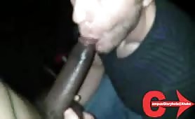 Sucking a big cock in an adult video arcade booth