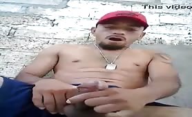 Horny latino wanking his cock outdoor and shooting a huge load