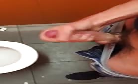 Wanking my huge cock in a public toilet